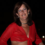 Cherry posing in see-through top and short skirt